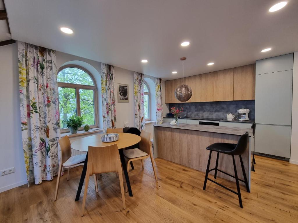 Kitchen and dining area with arched windows