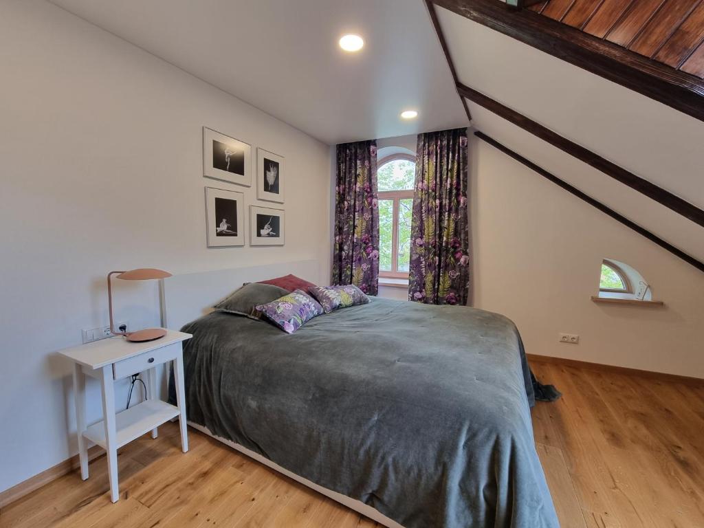 Bedroom with ballet artwork and floral curtains
